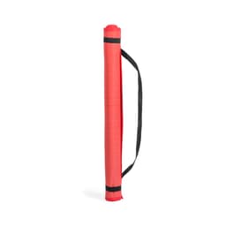 A red rolled-up mat with a black handle, featuring a textured surface. It has a logo on one side.
