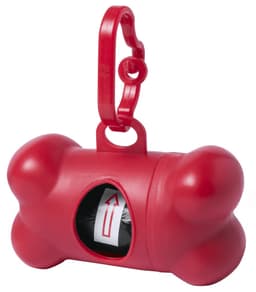 A red bone-shaped waste bag dispenser with a clip and a visible roll of bags inside.