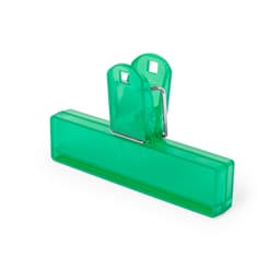 A green plastic clip with a metal spring mechanism, designed for holding items securely.