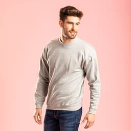 A grey hoodie is displayed on a model against a pink background, featuring a simple design and a logo.
