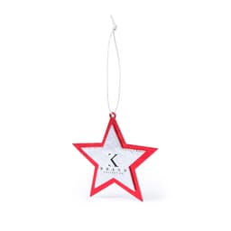 A red star-shaped Christmas decoration with a silver centre and a white hanging string, featuring a logo.