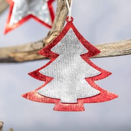 A decorative Christmas ornament in the shape of a tree, featuring red and silver glitter.