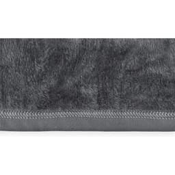 A soft grey fabric featuring a smooth edge. The texture appears plush and cozy, suitable for various uses.