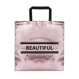 A shiny rose gold bag with black handles and a logo. The front features the word “BEAUTIFUL” prominently.