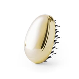 A gold hairbrush with black bristles, featuring a sleek, oval shape and a glossy finish.