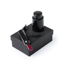 A drink bottle in black, with a corkscrew and a cylindrical stopper, placed on a black box.