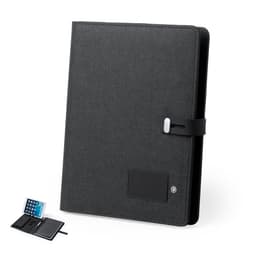 A black Weston Notebook featuring a textured cover, a strap closure, and an interior with a card holder and device slot.