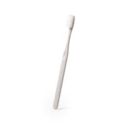 A light grey toothbrush with a straight handle and soft bristles. It features a simple design and an eco-friendly look.