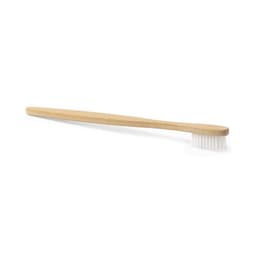 A natural bamboo toothbrush with a long handle and soft bristles, featuring no visible branding.
