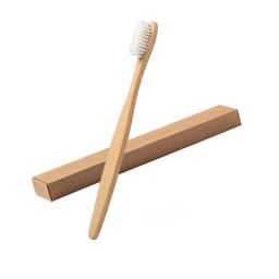 A bamboo toothbrush with white bristles, presented alongside a brown cardboard packaging.