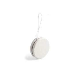 A white yo-yo with a string attached, featuring a smooth, rounded design. It includes a logo on its surface.