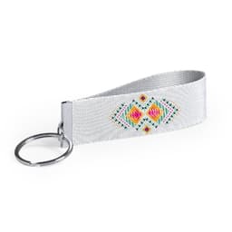 A silver keyring featuring a patterned fabric strap with vibrant geometric designs and a circular metal ring.