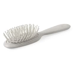 A grey hairbrush with a rounded handle and fine bristle design, featuring a logo on the side.