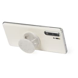 A white phone stand with a circular grip attached to the back of a smartphone. The phone is silver.