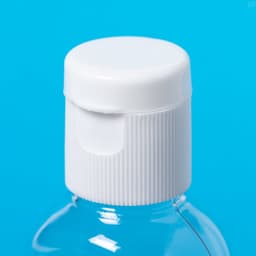 A transparent bottle with a white flip-top cap, featuring a textured grip around the lid.