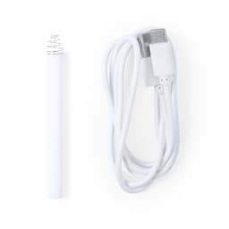 A white USB charging cable alongside a white cylindrical device with a metallic spring-shaped end.