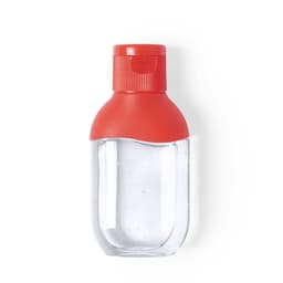 A hand sanitiser bottle with a clear body and a red cap. The bottle has a rounded design.