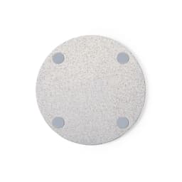 A round, light grey wireless charger with four non-slip pads at the base. Features a subtle texture throughout.