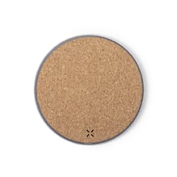 A circular wireless charger with a cork surface and a silver edge, featuring a discreet logo.