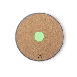 A round wireless charger featuring a natural cork surface with a green charging indicator. The base is grey.