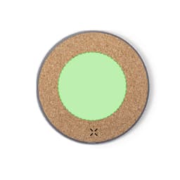A round wireless charger featuring a cork surface with a green centre and a silver edge.