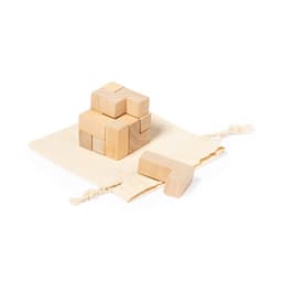 A set of wooden puzzle blocks in natural colour, resting on a cotton bag. The blocks are arranged in a stacked formation.