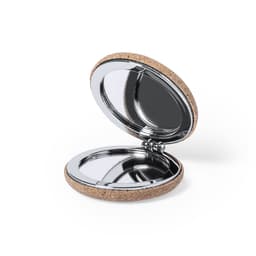 A compact pocket mirror with a shiny interior and a textured cork exterior. It has a circular shape and opens to reveal two mirrors.