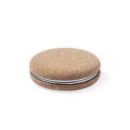 A round, beige pocket mirror with a textured surface and a thin black band around the edge.