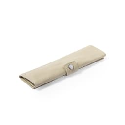 A beige cutlery roll with a button closure, designed for storing cutlery sets.