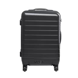 A black wheeled bag with a ridged design and a logo, featuring a sturdy handle and four wheels for easy transport.