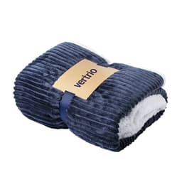 A navy blue ribbed blanket with a soft white interior, featuring a logo on the band.