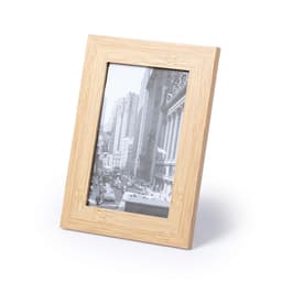 A wooden photo frame in a light natural finish, featuring a black and white cityscape image.