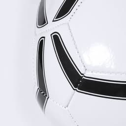 A white soccer ball with black detailing and seams, featuring a logo.