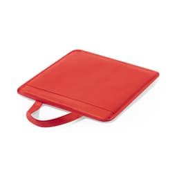 A red cushion with a textured surface and a handle on one side. It has a simple, minimalist design.
