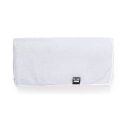 A white absorbent towel with a textured surface and a logo on one corner.