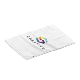 A white absorbent towel featuring a colourful logo and branding. The towel is soft and folded flat.