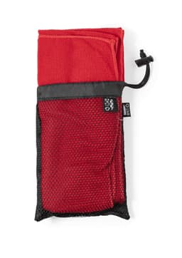 A red absorbent towel folded and stored in a black mesh pouch with a drawstring closure.