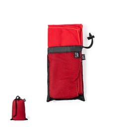 A red hand towel folded and stored in a black mesh pouch, featuring a drawstring closure.