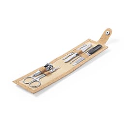 A beige manicure set featuring scissors, a nail clipper, tweezers, and a file, all neatly organised in a foldable case.