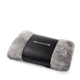 A grey blanket with soft, plush edges and a black section featuring a logo.