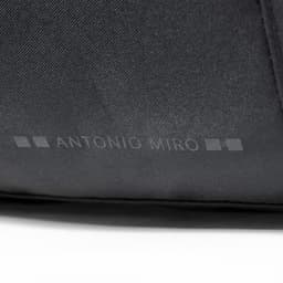 A close-up of a black bag featuring a logo and a sleek design.