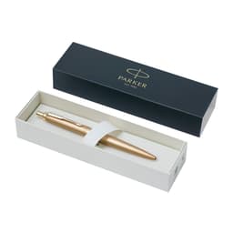 A metal pen in a gold finish situated in a gift box with a logo. The box is black with a white interior.