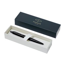 A sleek black metal pen rests in an open presentation box, featuring a simple logo on the lid.