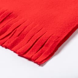 A red scarf featuring fringed edges, constructed from soft fabric. It has a simple design and a logo.