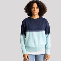 A blue and aqua gradient jumper with a crew neckline and a logo on the front, worn by a model.