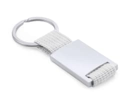 A keyring featuring a silver metallic tag and a white fabric strap with a circular metal ring attachment.