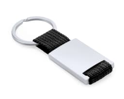 A silver keyring with a rectangular metal piece and a black woven strap. Features a logo on the metal.