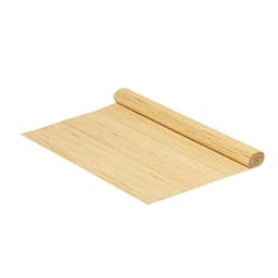 A bamboo mat rolled partially open, showcasing its natural beige colour and smooth texture. It features a simple design.