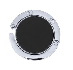 A circular chrome bag hanger with a black centre, featuring a metal loop and a polished finish.