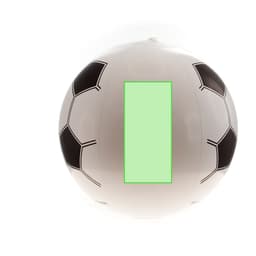 A beach ball designed like a soccer ball, featuring black hexagonal patterns on a white surface and a blank green area.